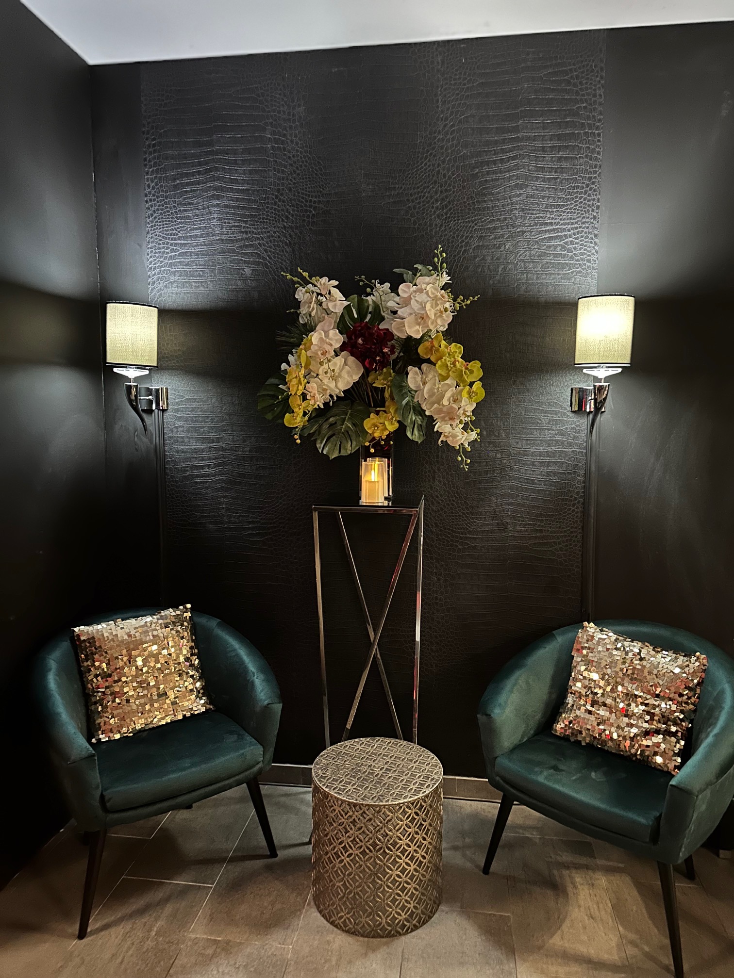Elegant studio corner with chairs and floral styling