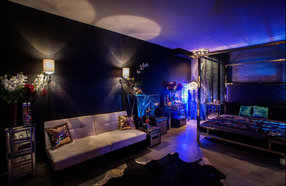 Luxurious photo studio interior with sofa and bed